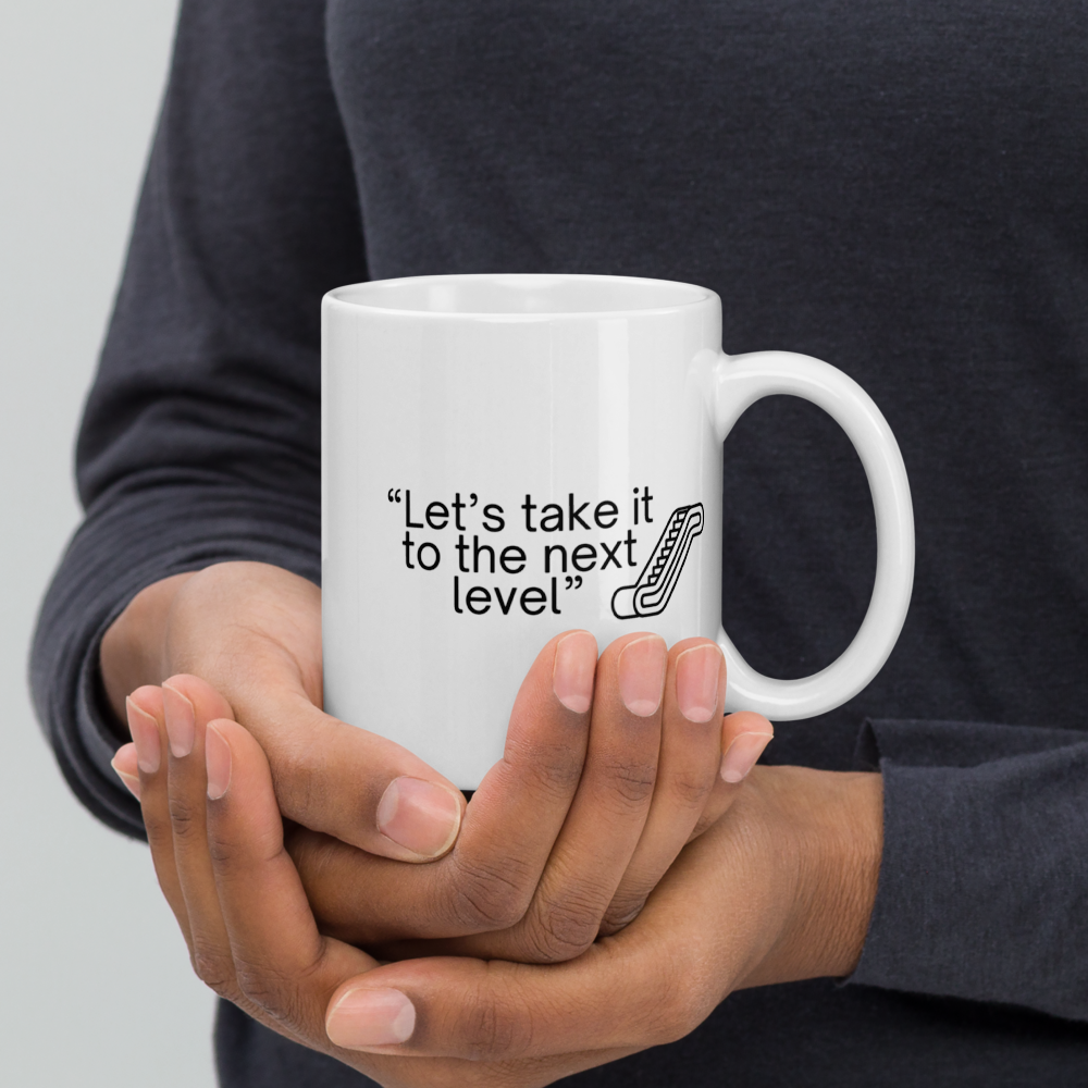 "Let's take it to the next level" - Office Jargon Mug